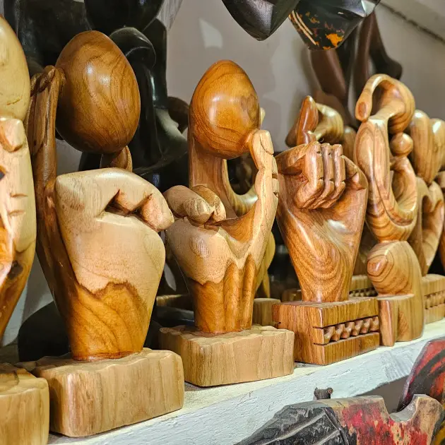 Hand-Carved Two-Tone Egg-in-Hand Sculpture